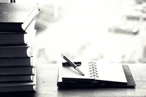 A stack of textbooks on a table 写真素材