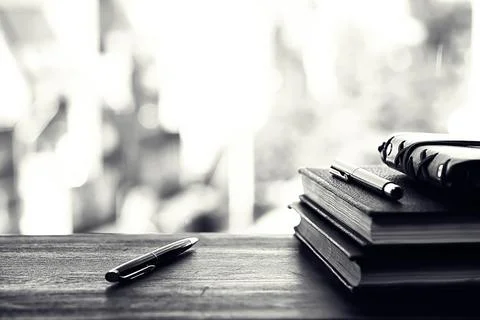 A stack of textbooks on a table 写真素材