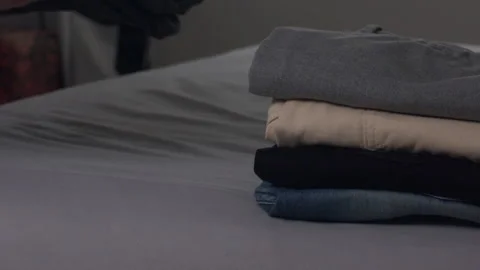 Stack them steady, don’t let them slide, fabric tower, stands with pride Stock Footage 293452758