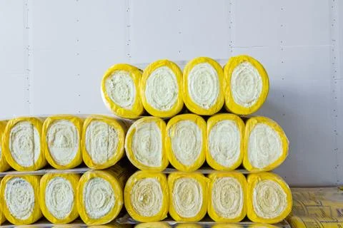 Stack of thermal insulation material in roll is wrapped with cellophane foil Stock Photos