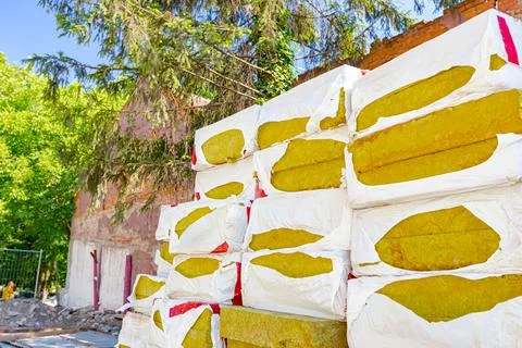 Stack of thermal insulation material is wrapped with cellophane foil Stock Photos