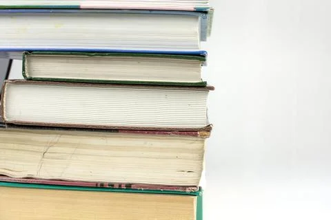 Stack of thick books on white background Stock Photos