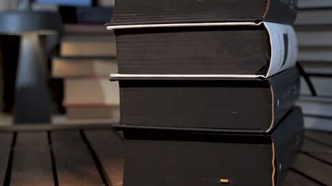 Stack of Thick Hardcover Books on Wooden Table Stock Footage 336483145