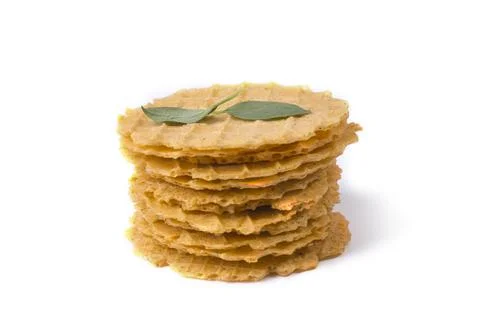 A stack of thin crispy salty waffles with lemon basil leaves Stock Photos