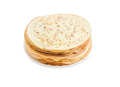 Stack of thin round pancakes on white dish Stock Photos