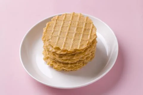 A stack of thin salty waffles on a plate Stock Photos