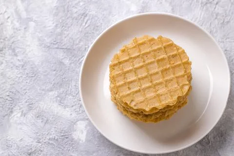 A stack of thin salty waffles on a plate Stock Photos