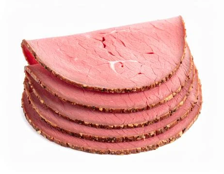 Stack of Thinly Sliced Cooked Roast Beef Deli Meat, Lean Red Protein Isolat.. Stock Photos