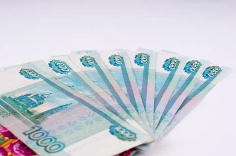 A stack of thousand-ruble banknotes, spread out and an envelope for money. .. Stock Photos