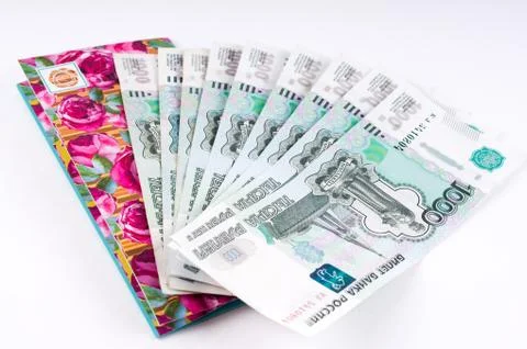 A stack of thousand-ruble banknotes, spread out and an envelope for money. .. Stock Photos