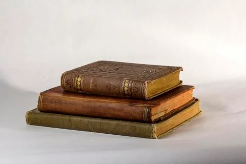 Stack of Three Antique books on a white background. Stock-Fotos