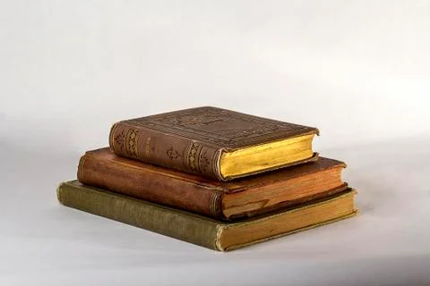 Stack of Three Antique books on a white background. Stock-Fotos