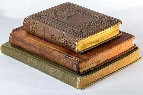 Stack of Three Antique books on a white background. Stock Photos