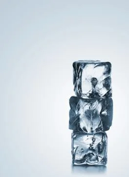 Stack of three blue ice cubes with copyspace 스톡 사진