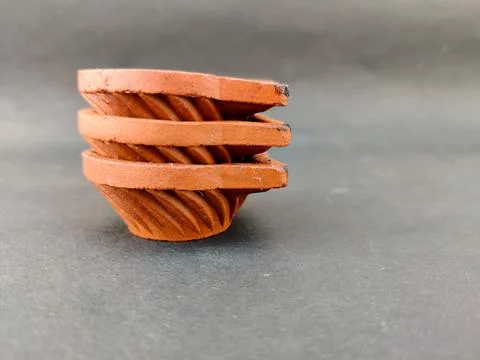 A stack of three Clay lamp or diya or oil lamp. Indian type.Isolated on black Stock Photos