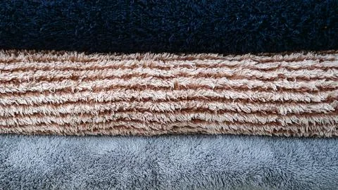 Stack of Three Colored Fluffy Terry Towels in Close-up Texture 스톡 사진