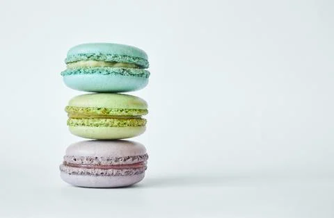 Stack of three colorful French Macarons, macaroons cakes with different flavo 写真素材