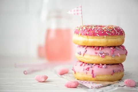A stack of three donuts in glaze Stock Photos