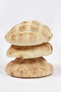 Stack of three fresh flatbreads on white background. 스톡 사진