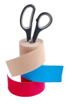 Stack of three rolls kinesiology tape for athletes and scissors isolated on Stock Photos