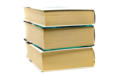 Stack of three thick books on white background. Paper dictionaries, encyclope Stock Photos