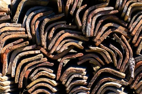 A stack of tiles, a clay roof, background and Stock Photos