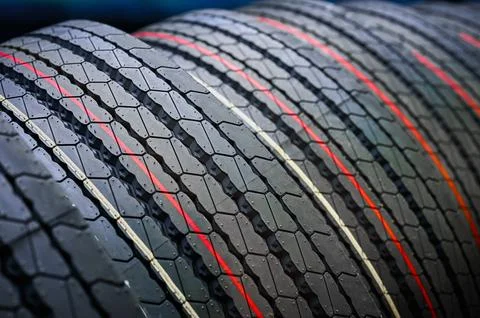 Stack of tires with markings red and yellow lines Stock Photos