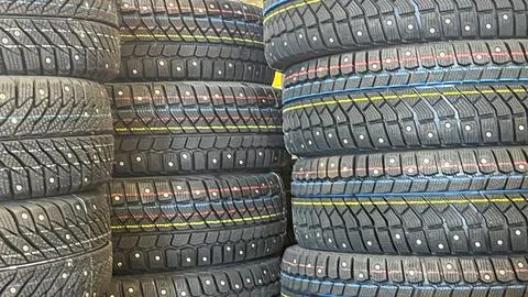 A stack of tires with a yellow stripe on them Stock Photos