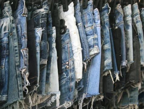 A stack of torn old jeans Stock Photos