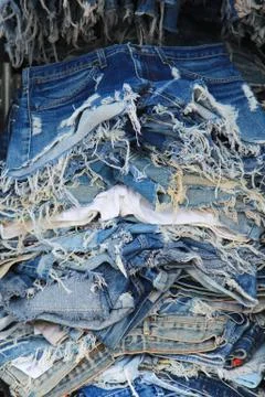 Stack of torn old jeans Foto stock