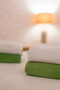 Stack towel set on bed in modern bedroom at hotel Stock-Fotos