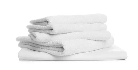 Stack of towels and bed sheet on white background 스톡 사진
