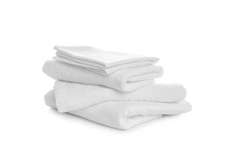 Stack of towels and bedding on white background 写真素材