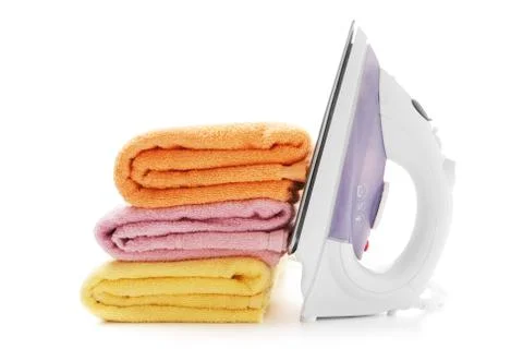 Stack towels and electric iron Stock Photos