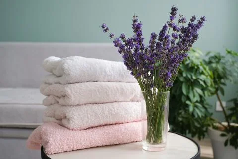 A stack of towels and lavender. The concept of protecting clothes from moths Stock Photos