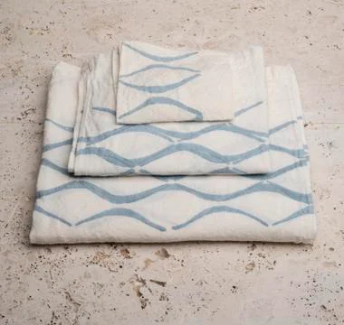Stack of Towels with Blue Concave Lines at High Angle Stock Photos
