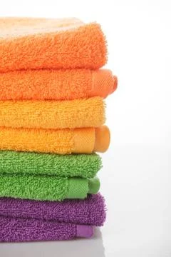 Stack towels isolated Stack of colorfull towels isolated on white Copyrigh... Stock Photos