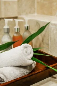 Stack of towels with a soap dispenser Stock Photos