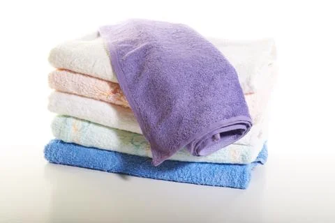 Stack of towels on a white background Stock Photos