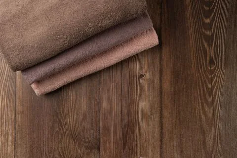 Stack of towels on wooden background Stock Photos