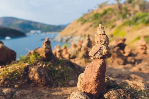 Stack tower stone zen art folded blurred rock background. large small ascending Stock Photos