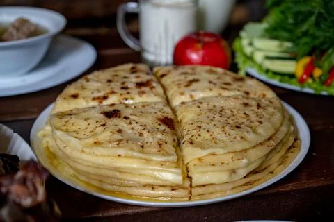 A stack of traditional Caucasian flatbreads with stuffing with mashed potatoes Stock Photos
