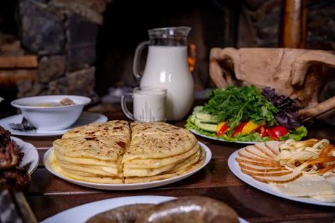 A stack of traditional Caucasian flatbreads with stuffing with mashed potatoes Stock Photos