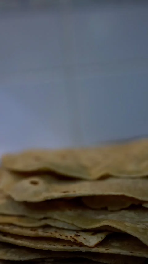 Stack of traditional chapati flatbread ready for dinner Stock Footage 343810251