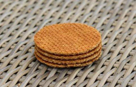 Stack of traditional dutch stroopwafels cookie, a caramel syrup waffle, on wo Stock Photos