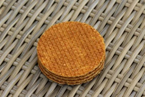 Stack of traditional dutch stroopwafels cookie, a caramel syrup waffle, on wo Stock Photos