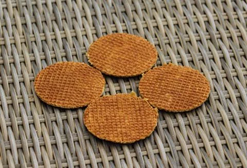 Stack of traditional dutch stroopwafels cookie, a caramel syrup waffle, on wo Stock Photos