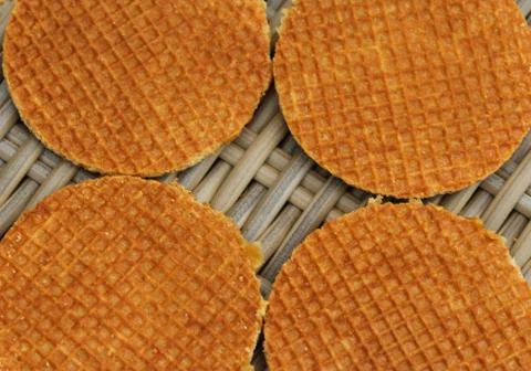 Stack of traditional dutch stroopwafels cookie, a caramel syrup waffle, on wo Stock Photos