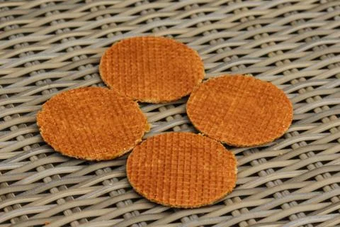 Stack of traditional dutch stroopwafels cookie, a caramel syrup waffle, on wo Stock Photos