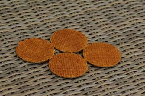 Stack of traditional dutch stroopwafels cookie, a caramel syrup waffle, on wo Stock Photos